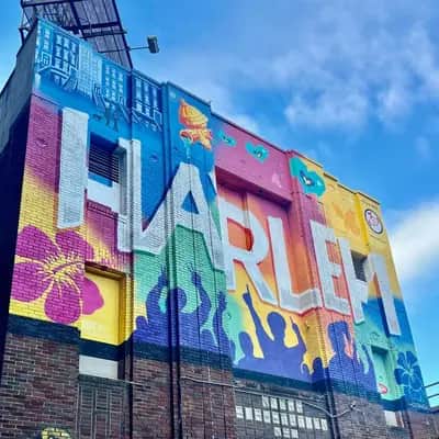 "Harlem Community Pride Mural" by Tats Cru in New York