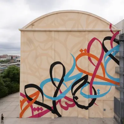 "Waves only exist because the wind blows" by El Seed in Milan