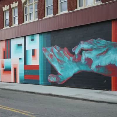"Reaching Hands Mural" by Dalek in Detroit
