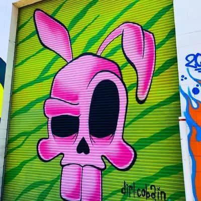 "Pink Skull with Bunny Ears" by Dirt Cobain in Oakland