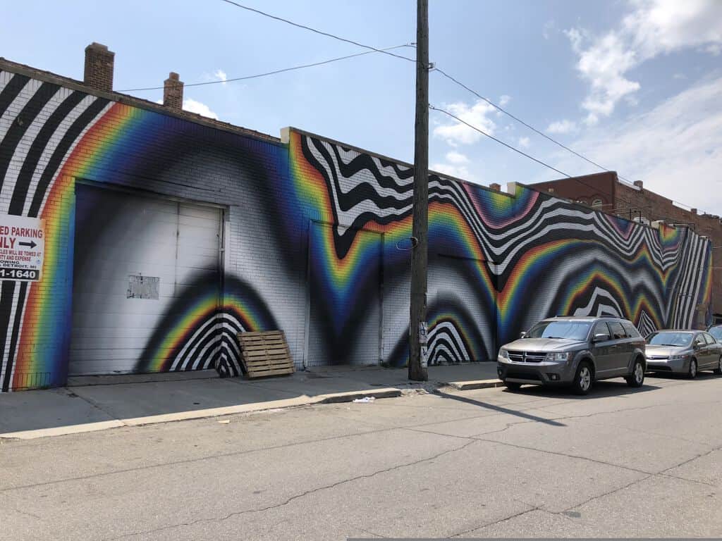 "Rainbow Waves Optical Illusion" by Felipe Pantone in Detroit