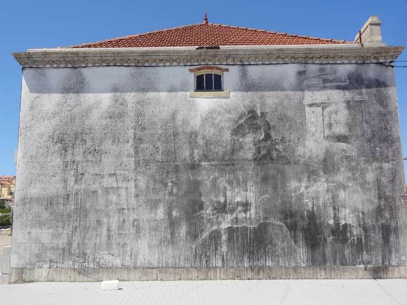 "Faded Portrait on Historic Facade" by Alexandre Farto aka Vhils in Lisbon