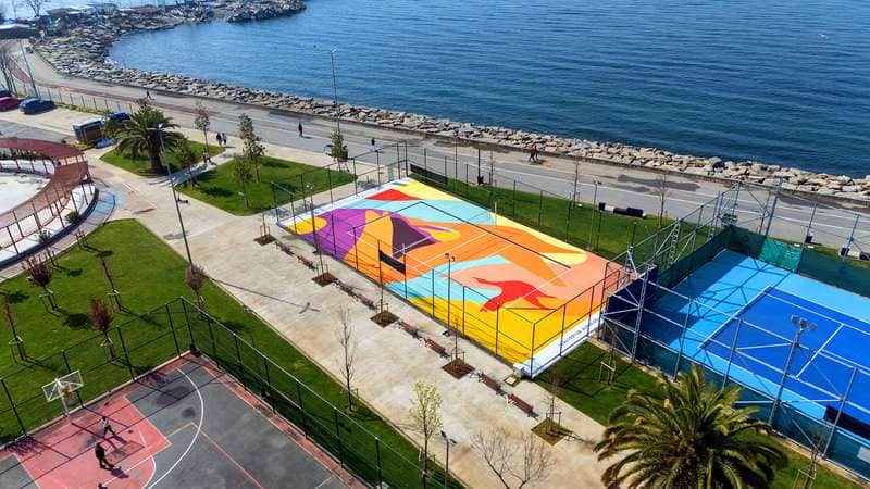 "Vibrant Waterfront Sports Court Mural" by Kien in Istanbul