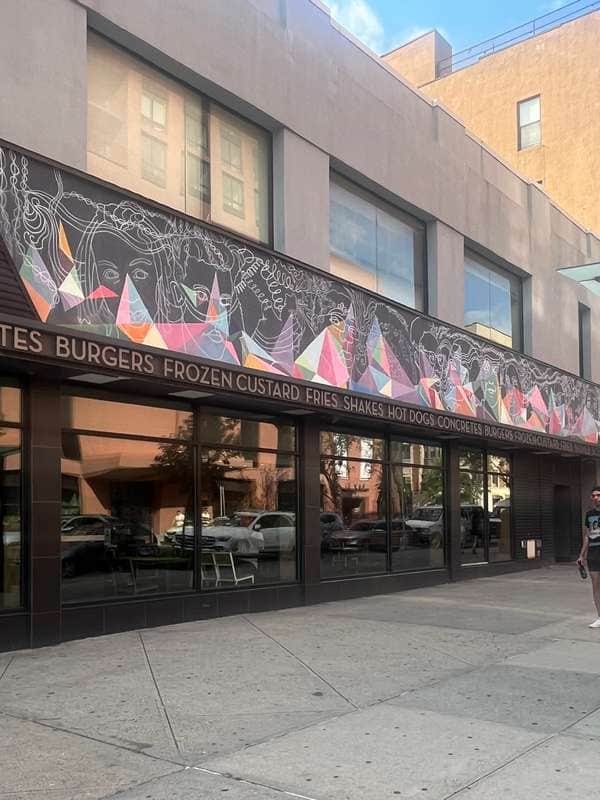 "Ethereal Faces Storefront Mural" by creative art works (CAW) in New York