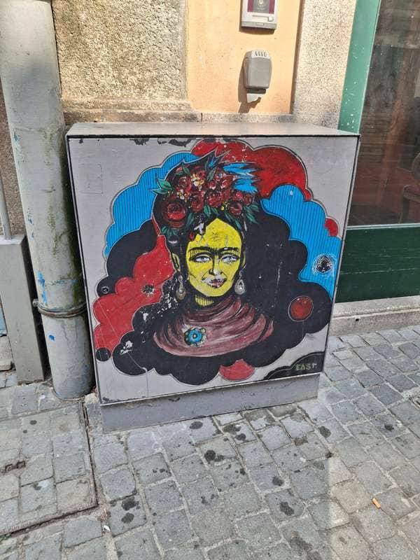 "Yellow-Faced Figure with Floral Crown" in Porto