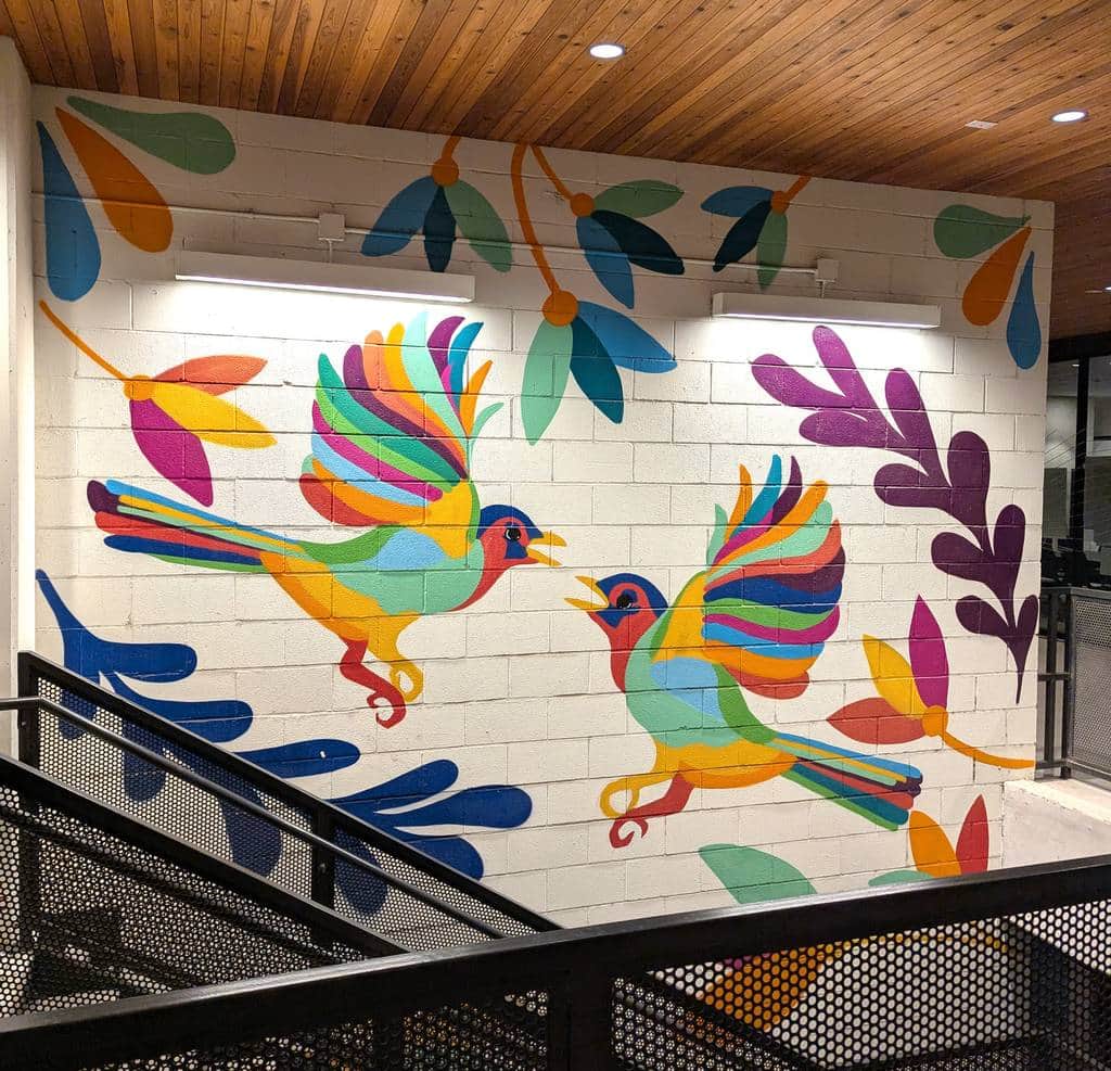 "Colorful Birds in Flight" by Ruben Esquivel in Austin