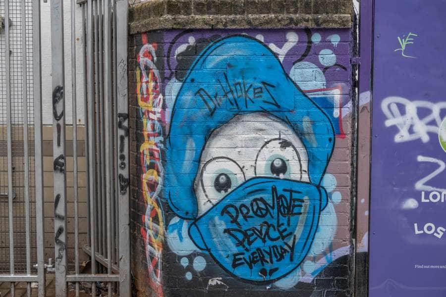 "Blue Smurf Character with Graffiti" by Dr.Hokes in London