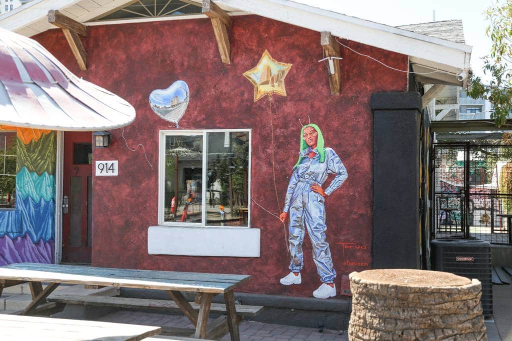 "Astronaut Figure on Red Wall" by Lucretia Torva in Phoenix