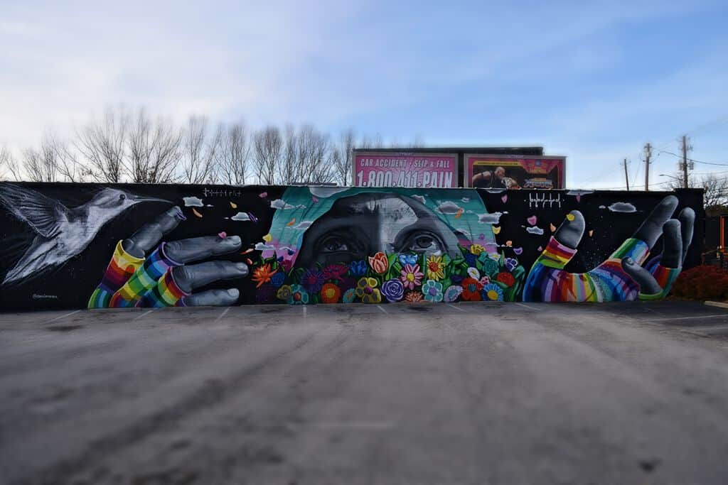 "Hands Nurturing Floral Growth" by Dasic Fernandez in Atlanta