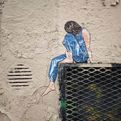 "Contemplative Figure on Wall" by Jana & JS in Paris