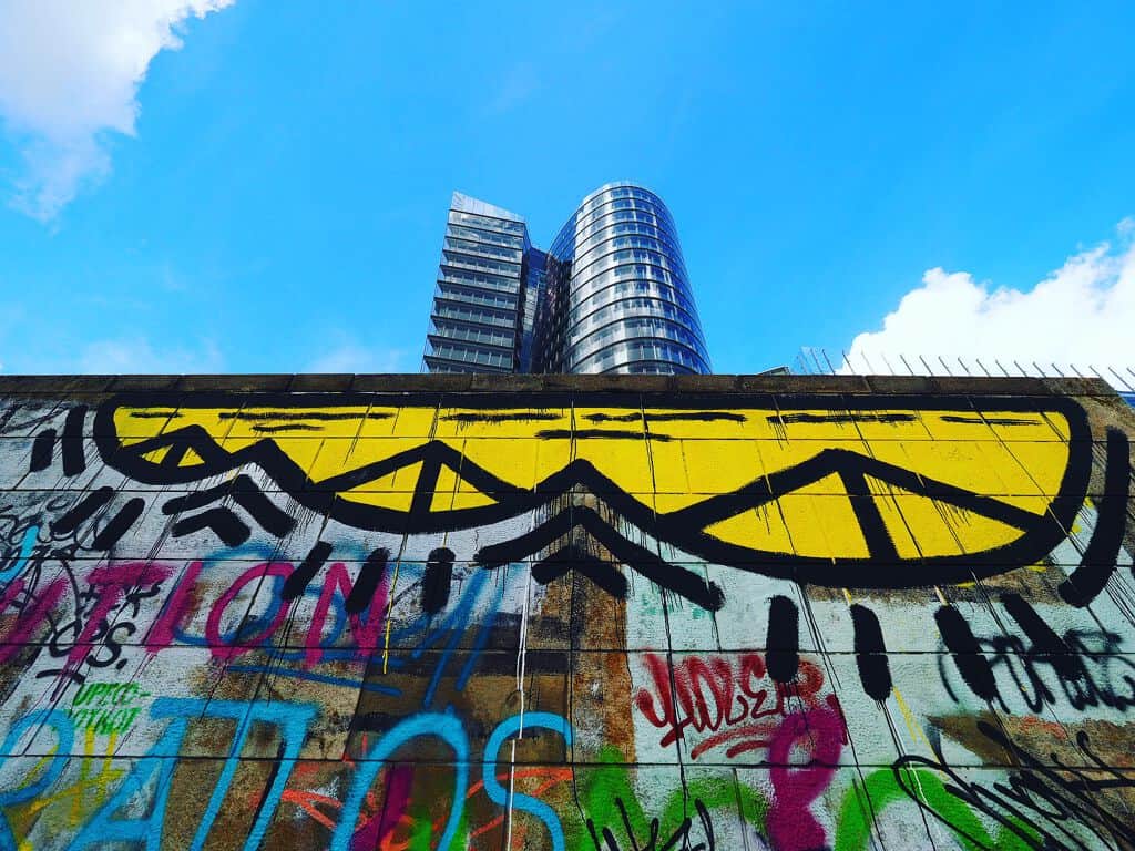 "Geometric Eyes Above Urban Landscape" by Kryot in Vienna
