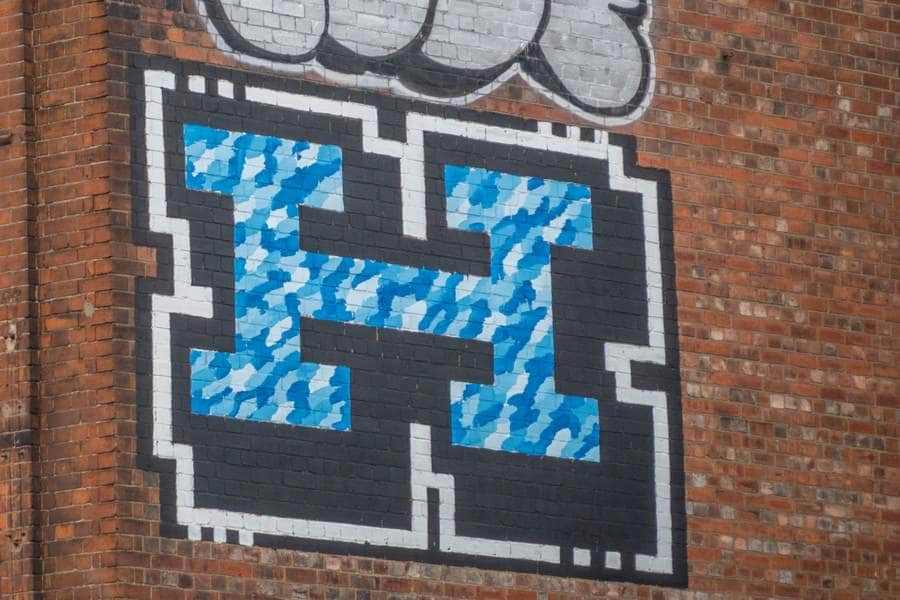 "Pixelated Face with Blue Eyes" by Helch in London