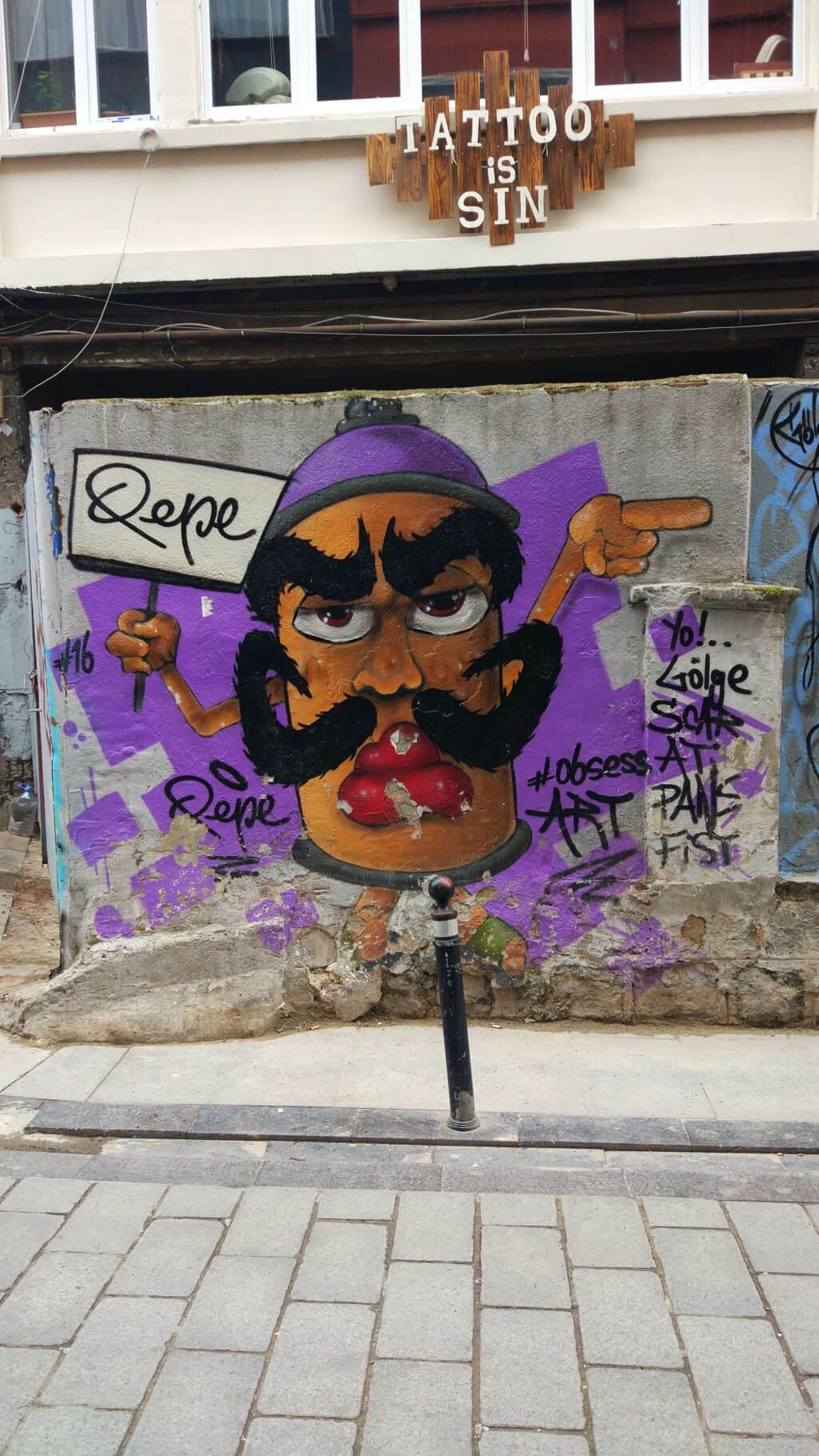 "Expressive Portrait with Rope Sign" by Pepe in Istanbul