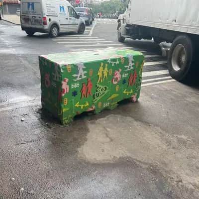 "Graffiti decorated bench" in New York