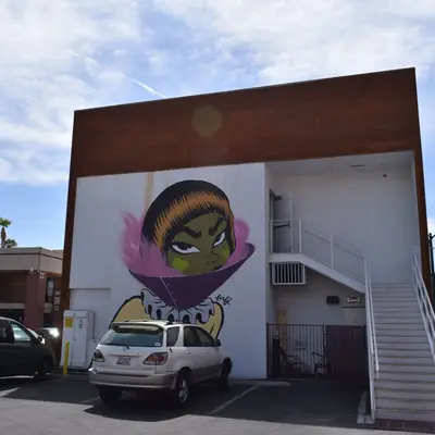 "Green Face Portrait Mural" by Fafi in Las Vegas