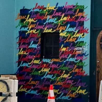 "Repetitive Love Text Mural" by Ruben Rojas in Los Angeles