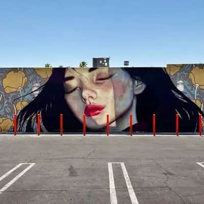 "Woman with Floral Backdrop" by Yanoe in Los Angeles