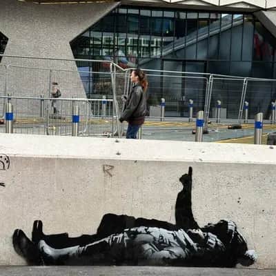 "Fallen Figure Street Mural" by Banksy in London
