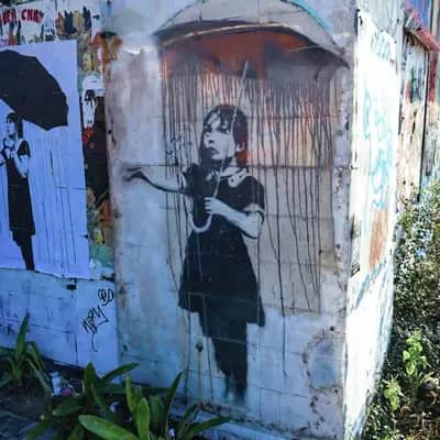"Umbrella Girl" by Banksy in New Orleans