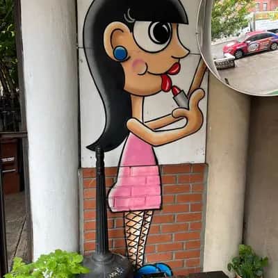 "Cartoon Woman with Microphone" by Tom Bob in New York