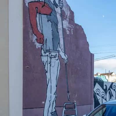 "Figure with Red Sweater Mural" by Tomás Serrão in Lisbon
