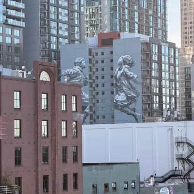 "Giant Running Figures Mural" by INO in Seattle