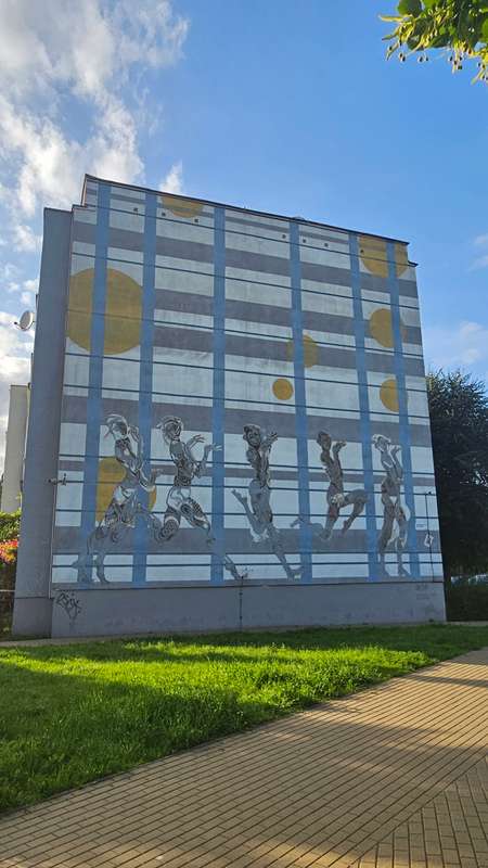 "Silhouetted Figures Against Grid" by Pan Liping in Zaspa Myniec, Gdansk