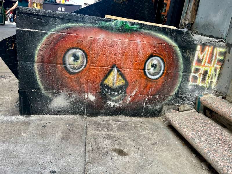 "Orange Masked Face Mural" by Muebon in Chinatown, New York
