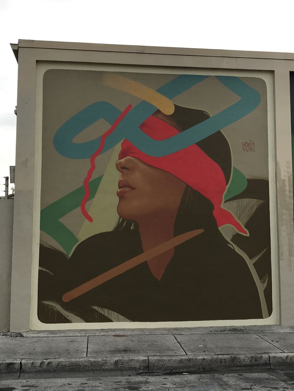 Figure with Red Headwrap and Tools