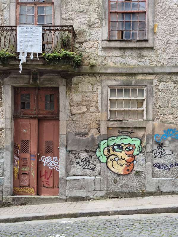 Cheerful Cartoon Character on Weathered Facade