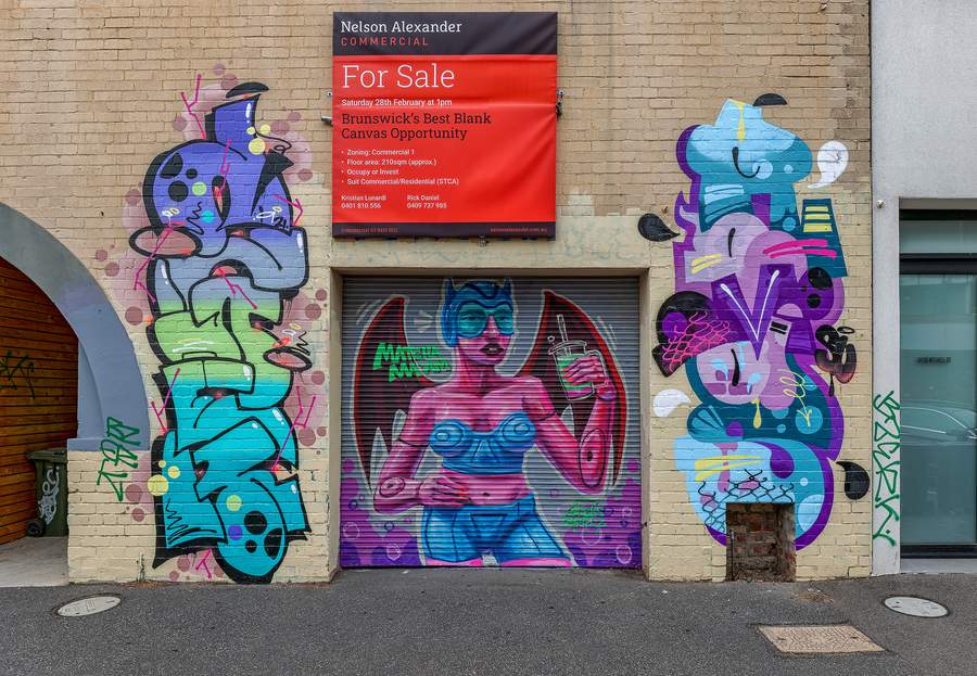 Vibrant Abstract Figures on Brick