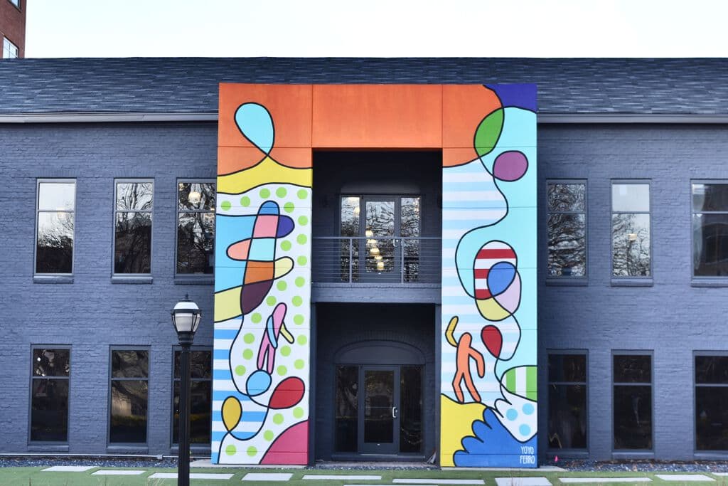 Colorful Whimsical Figures on Facade