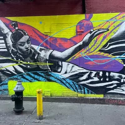 Winged Figure Street Mural