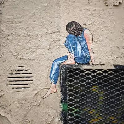 Contemplative Figure on Wall