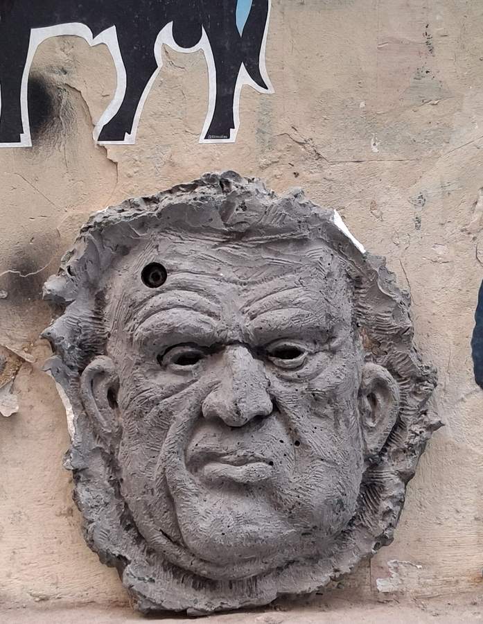 "Weathered Stone Head Sculpture" by Will Coles in Ciutat Vella, Valencia