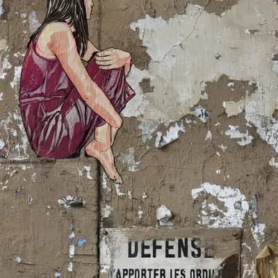 Seated Figure on Weathered Wall