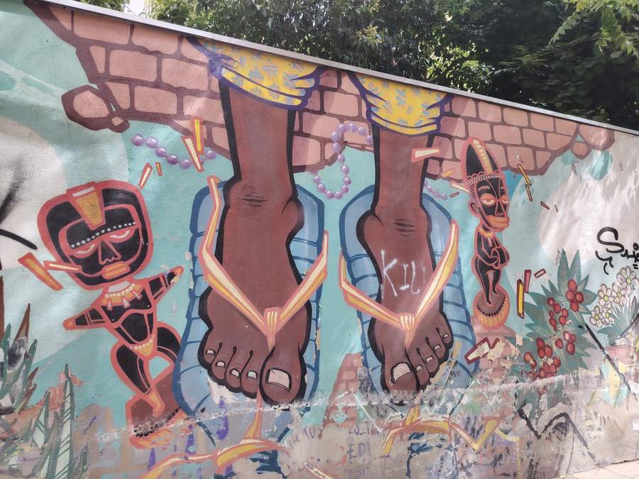"Colorful Feet and Tribal Figures" by Zeta1970 in Lavapis, Madrid