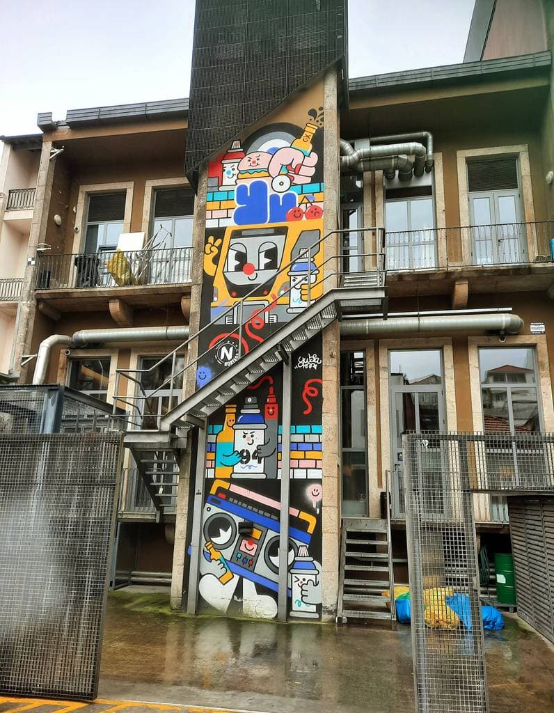 "Whimsical Characters in Construction" by yu_yubs in Baixa Do Porto, Porto