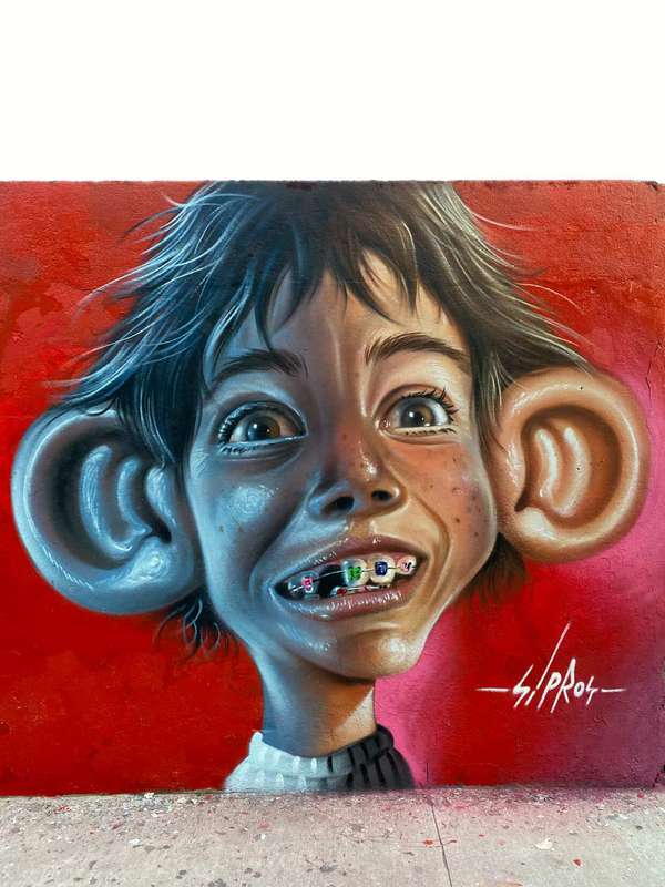 "Exaggerated Child Portrait with Braces" by Sipros in Centro, São Paulo