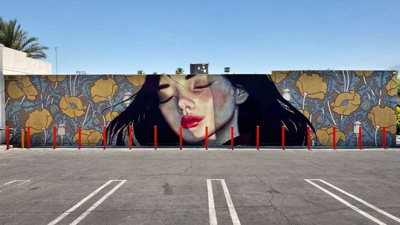 Woman with Floral Backdrop