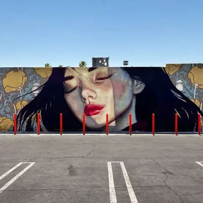 Woman with Floral Backdrop