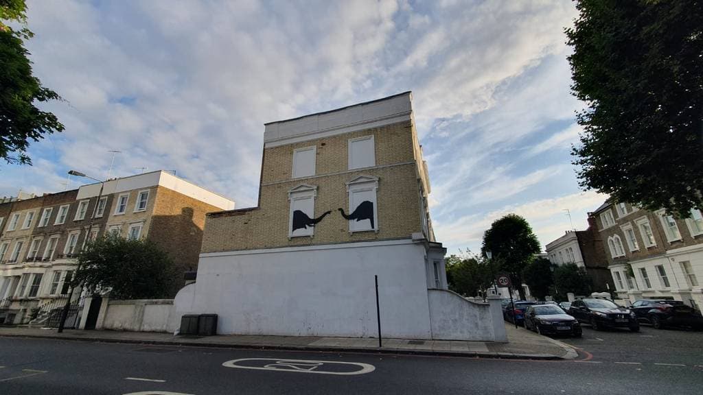 "Black Silhouette Window Figures" by Banksy in Worlds End, London