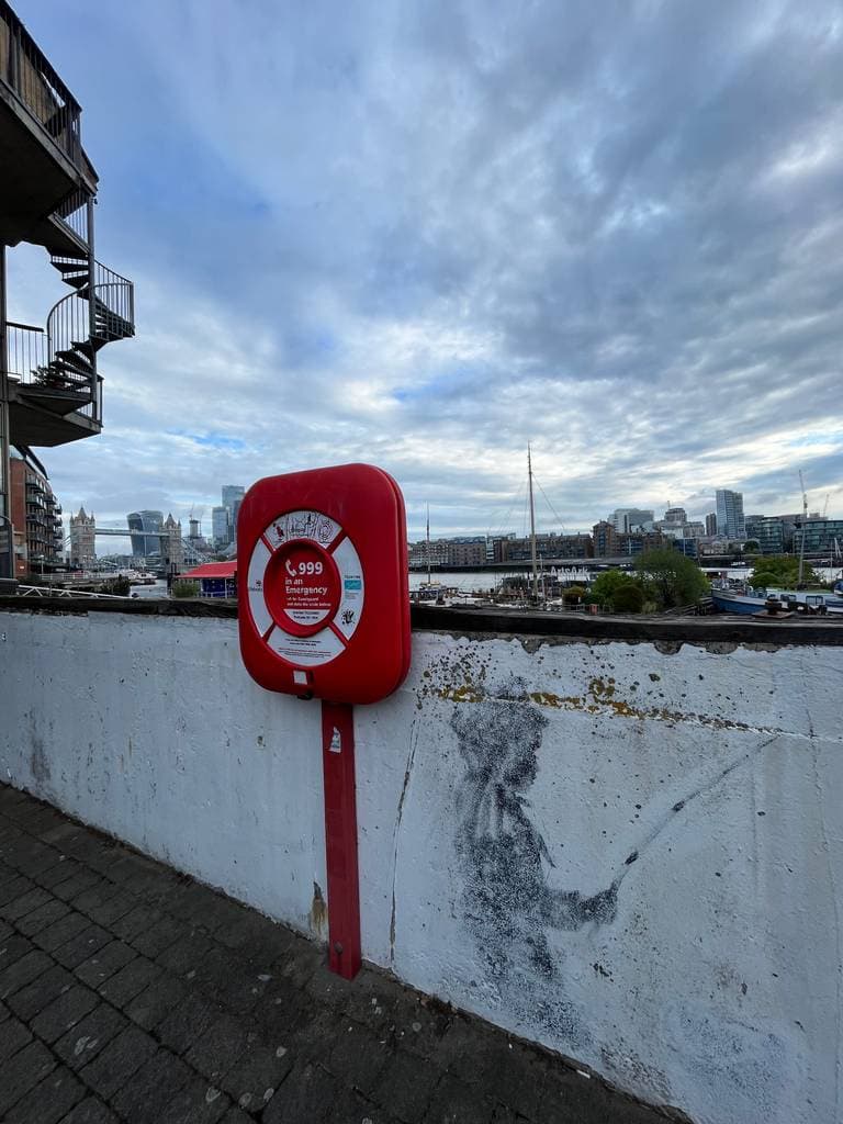 "Fishing Boy" by Banksy in Butlers Wharf, London