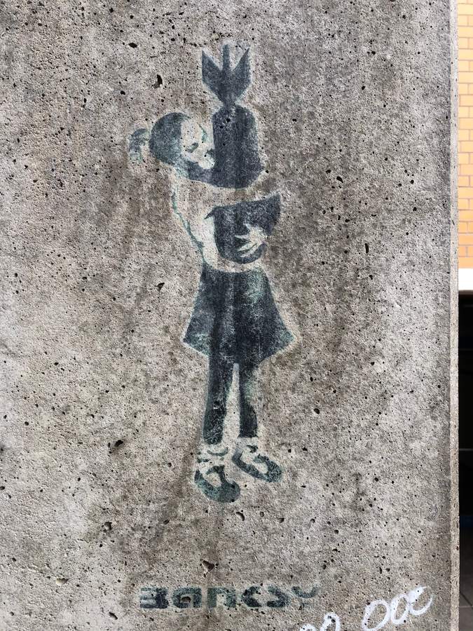 "Bomb hugger (real & fake)" by Banksy in Portugiesenviertel, Hamburg