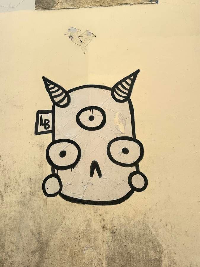 "Three-Eyed Horned Character" by Lambiscada in Bairro Alto, Lisbon