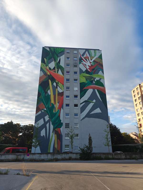 "Tropical Foliage Tower Mural" by Thiago Mazza in Kg Brigittenau, Vienna