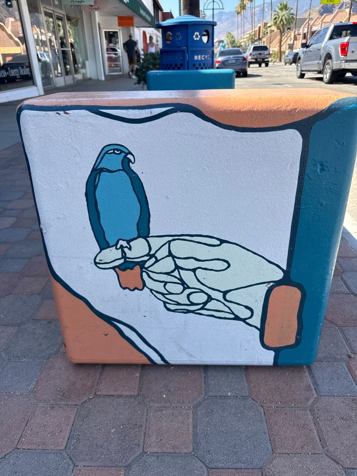 "Hand Holding Blue Bird Perched" in Palm Springs