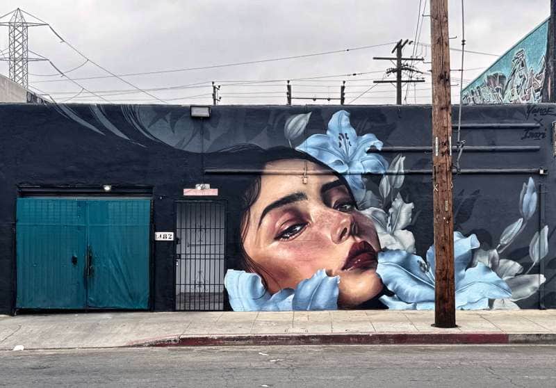 "Woman with Blue Flowers" by Yanoe in Los Angeles