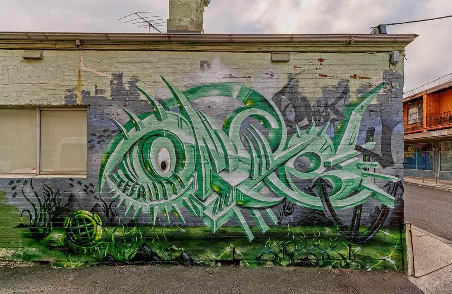 "Stylized Fish Eyes in Green" by Aerosol One in Melbourne