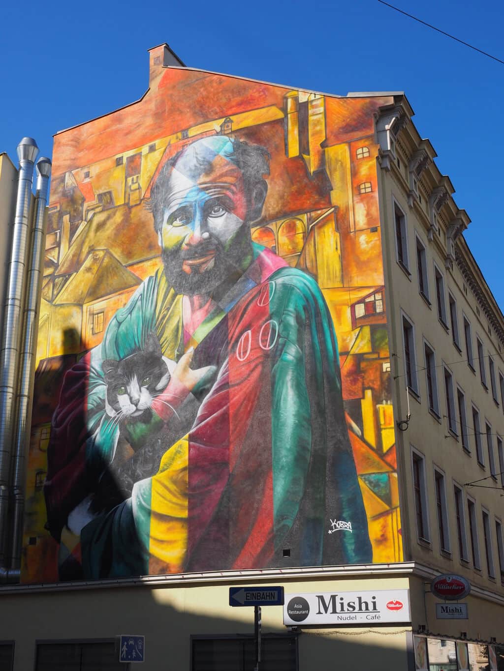 "Bearded Man with Cat Portrait" by Eduardo Kobra in Vienna